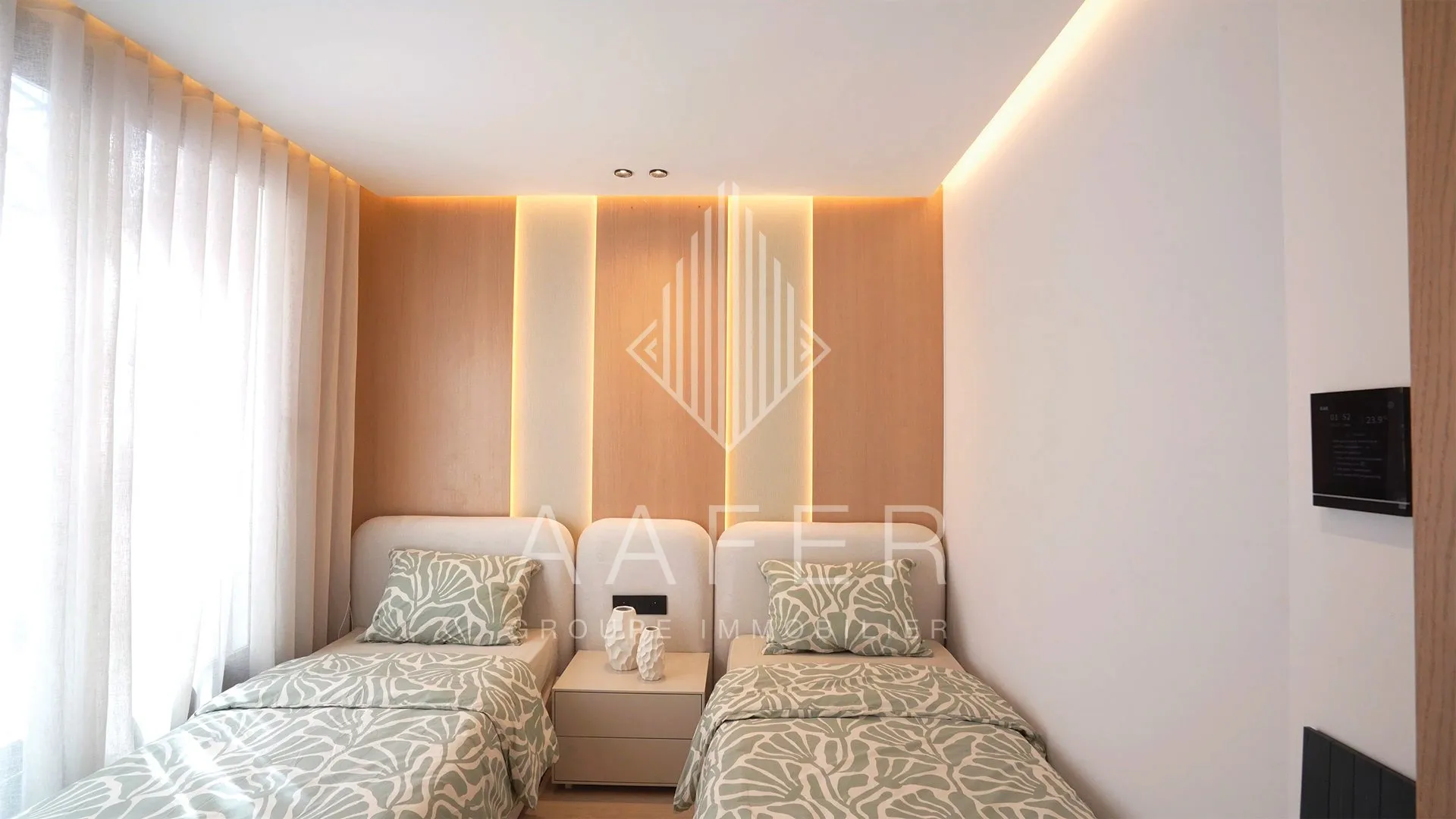 Slaapkamer met twee bedden in Résidence Alpinia