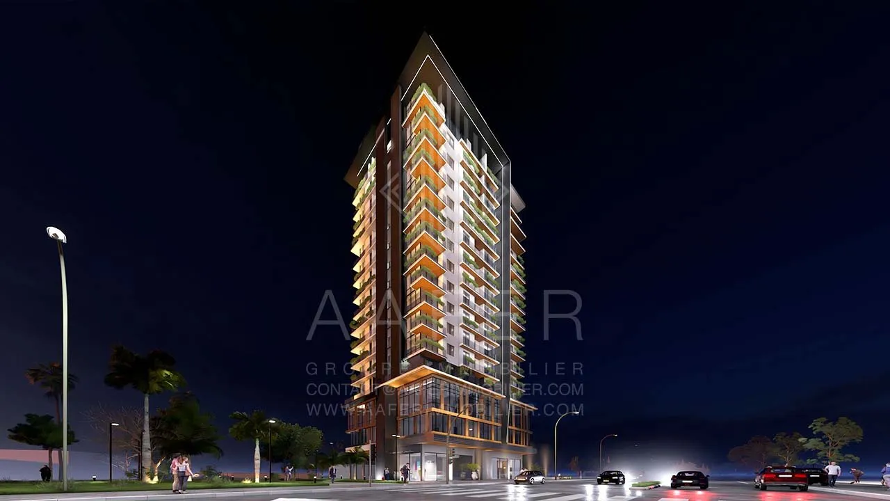 Gevel van Résidence Alpinia met verlichte balkons
