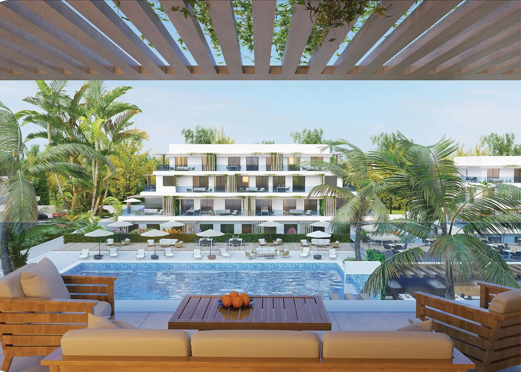 Lounge onder pergola met zicht op de zwembaden van Cabo Golf